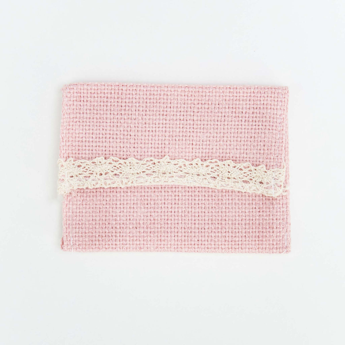 Cartera de yute en color rosa. 