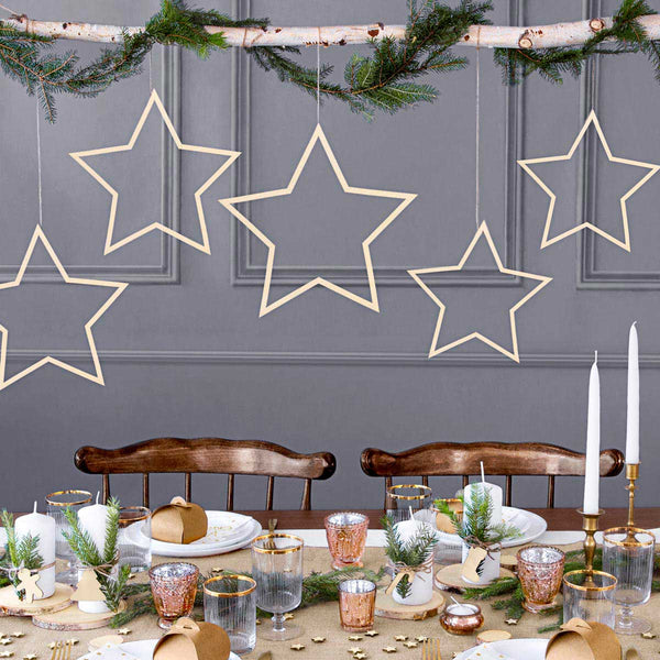 Estrella de madera colgante. Decoración natural para fiestas y eventos.
