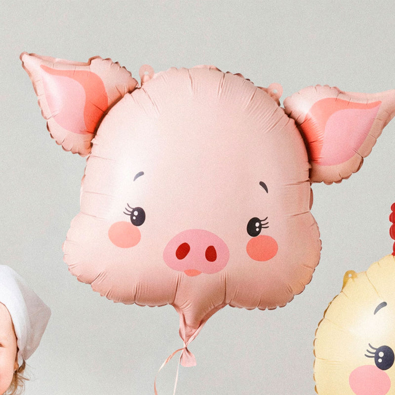 Globo foil con forma de cabeza de cerdito en rosa con pestañas y mejillas sonrosadas 61x36 cm