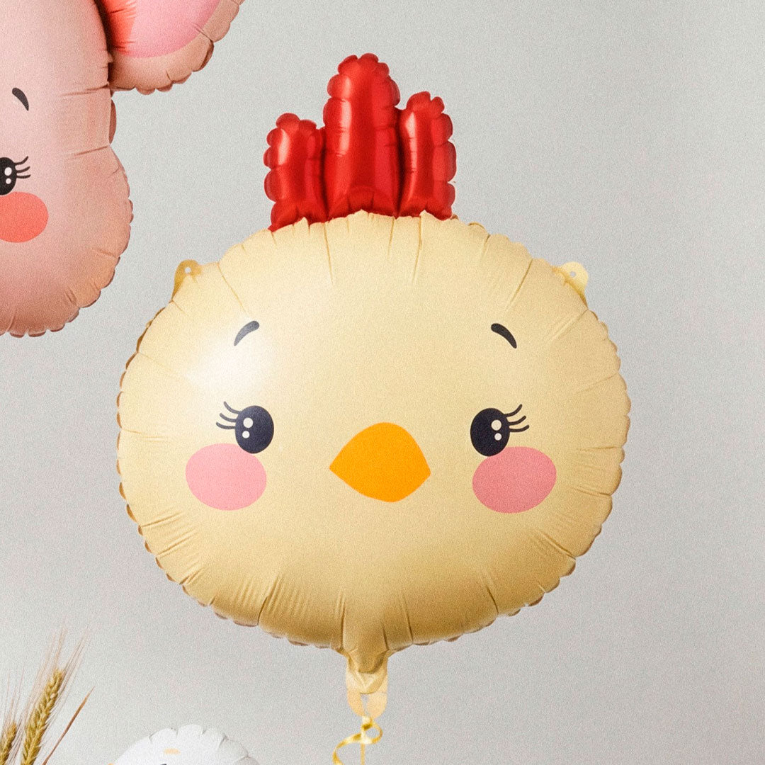 Globo foil con forma de cabeza de pollito en amarillo con cresta roja y pico naranja 51x59 cm