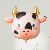 Globo foil con forma de cabeza de vaca en crema y negro con cuernos dorados 57x47 cm