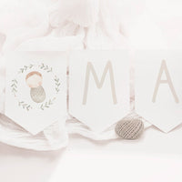 Guirnalda personalizada para bautizo de la colección rosquito bebé. 