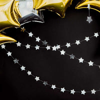 Guirnalda de estrellas en papel de aluminio plata espejo. Longitud 3,6 m, altura 5 cm.