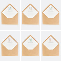 Opciones de diseño para los sobres personalizados de la invitación de comunión de la colección inicial.