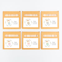 opciones de la caja de lápices de colores como detalles para niños de bautizo de la colección rosquito bebé. 