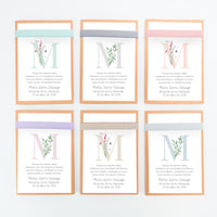 Opciones de color y diseño de la libreta con bolígrafo como detalle para invitados de comunión de la colección inicial