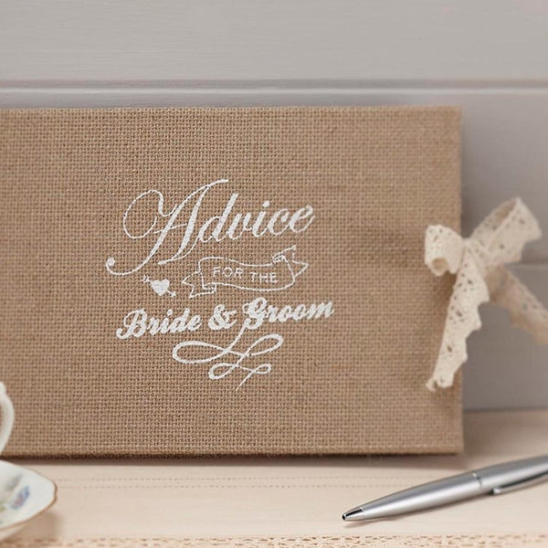 Libro de firmas de yute con puntilla beige e inscripción “Advice for the Bride & Groom”.