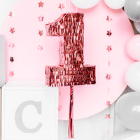 Decoración de primer cumpleaños con piñata número 1 oro rosa