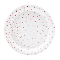 Detalle de los platos de papel blancos con topos en color oro rosa. 