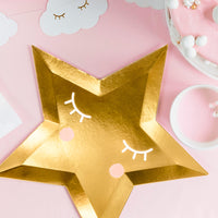 Platos de papel con forma de estrella en color dorado espejo. Pack de 6 unidades, diámetro 27 cm.