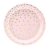 Detalle de los platos rosas con topos dorados. 