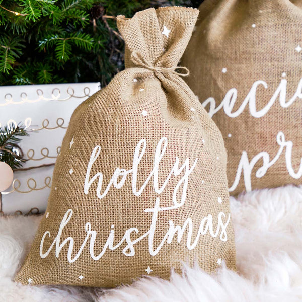Saco de yute con texto Holly Christmas y cordel de arpillera