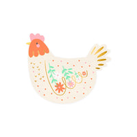 Detalle de la servilleta con forma de gallina, flores y acabado dorado
