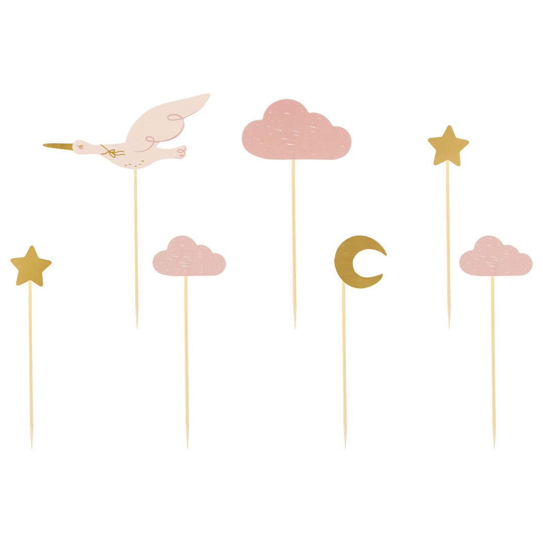 Detalle de los 7 diseños de toppers cupcakes cigüeña nubes y elementos dorados en rosa