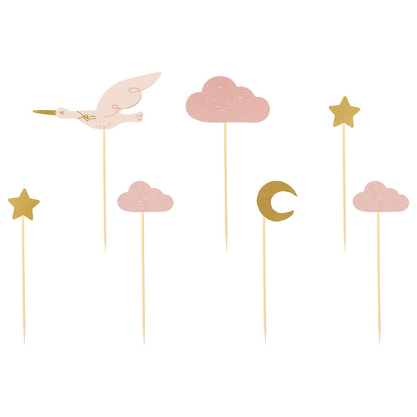 Detalle de los 7 diseños de toppers cupcakes cigüeña nubes y elementos dorados en rosa