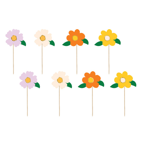 Detalle de los cuatro colores de toppers flores lila crema naranja y amarillo con hoja verde