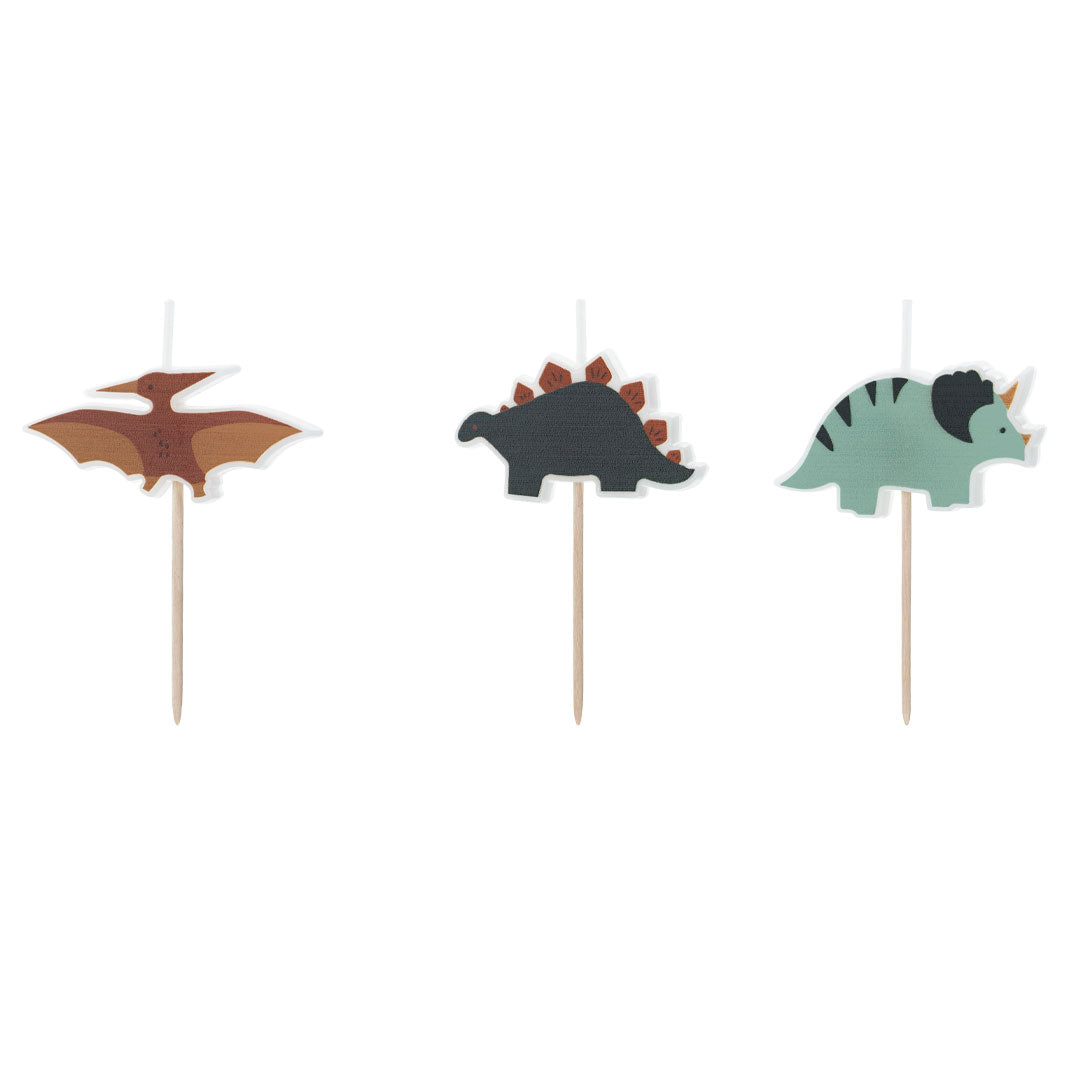Detalle de los tres diseños de velas dinosaurios pterodáctilo estegosaurio y triceratops